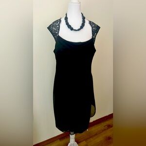 Semi formal black dress knee length.